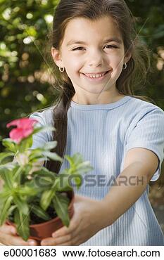 Stock Photo - girl with potted 
flower. fotosearch 
- search stock 
photos, pictures, 
images, and photo 
clipart