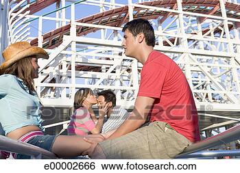 Stock Photo - couples at amusement 
park. fotosearch 
- search stock 
photos, pictures, 
images, and photo 
clipart