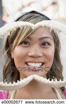 Picture - woman with model 
teeth. fotosearch 
- search stock 
photos, pictures, 
images, and photo 
clipart