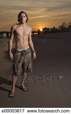 Picture - shirtless man 
at beach. fotosearch 
- search stock 
photos, pictures, 
images, and photo 
clipart