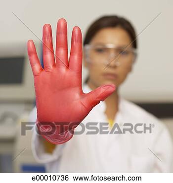 Stock Photo - scientist holding 
up gloved hand. 
fotosearch - search 
stock photos, 
pictures, images, 
and photo clipart