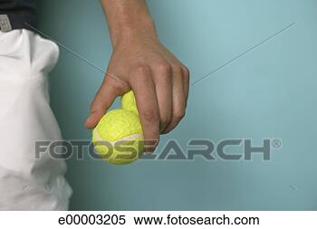 Stock Image - tennis player 
holding tennis 
balls. fotosearch 
- search stock 
photos, pictures, 
images, and photo 
clipart