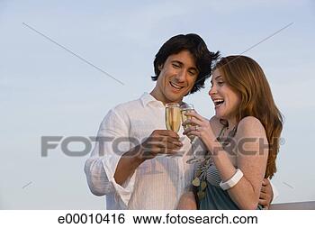 Stock Photo - couple toasting 
wine glasses outdoors. 
fotosearch - search 
stock photos, 
pictures, images, 
and photo clipart