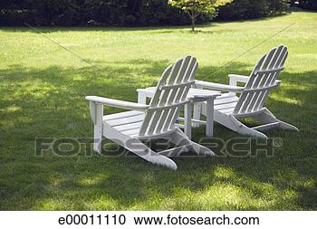 Stock Photography - empty adirondack 
chairs on lawn. 
fotosearch - search 
stock photos, 
pictures, images, 
and photo clipart