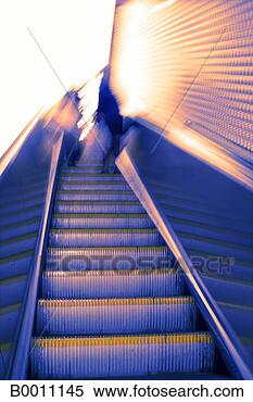 Stock Image - concept, escalator, 
female, low angle, 
motion, prime 
adult. fotosearch 
- search stock 
photos, pictures, 
images, and photo 
clipart