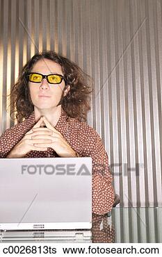 Stock Photo - a man looks up 
from his silver 
laptop computer 
while contemplating. 
fotosearch - search 
stock photos, 
pictures, images, 
and photo clipart