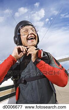 Picture - parachutist fastening 
helmet. fotosearch 
- search stock 
photos, pictures, 
images, and photo 
clipart