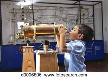 Stock Photo - boy looking through 
telescope. fotosearch 
- search stock 
photos, pictures, 
images, and photo 
clipart