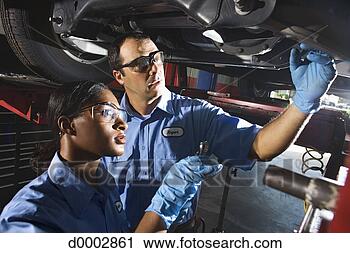 Stock Photography - auto mechanics 
fixing vehicle. 
fotosearch - search 
stock photos, 
pictures, images, 
and photo clipart