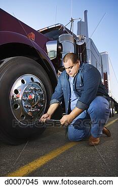 Stock Image - trucker fixing 
tire. fotosearch 
- search stock 
photos, pictures, 
images, and photo 
clipart