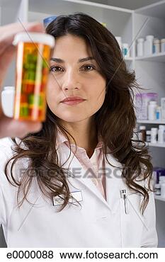Stock Photo - pharmacist holding 
a pill bottle. 
fotosearch - search 
stock photos, 
pictures, images, 
and photo clipart