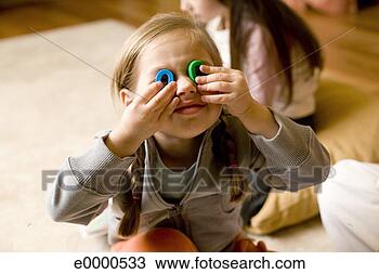 Stock Photo - girl looking through 
toys. fotosearch 
- search stock 
photos, pictures, 
images, and photo 
clipart