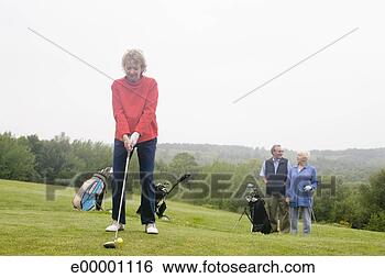 Stock Photo - senior woman playing 
golf. fotosearch 
- search stock 
photos, pictures, 
images, and photo 
clipart