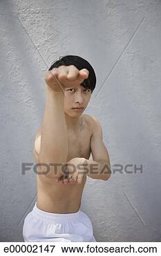 Picture - man performing 
martial arts. 
fotosearch - search 
stock photos, 
pictures, images, 
and photo clipart