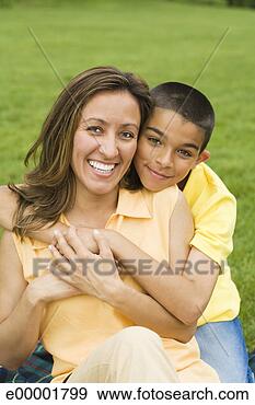 Stock Photograph - mother and son 
embracing in park. 
fotosearch - search 
stock photos, 
pictures, images, 
and photo clipart