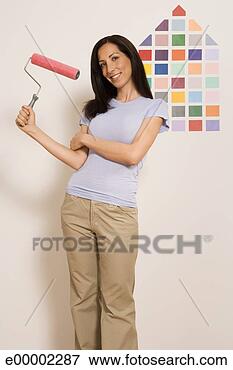 Picture - woman with roller 
standing near 
paint samples 
on wall. fotosearch 
- search stock 
photos, pictures, 
images, and photo 
clipart
