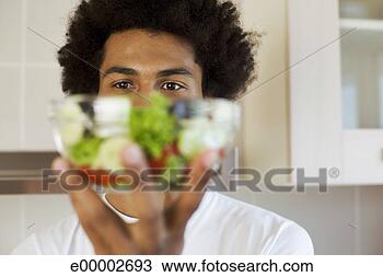 Stock Photo - man holding salad. 
fotosearch - search 
stock photos, 
pictures, images, 
and photo clipart