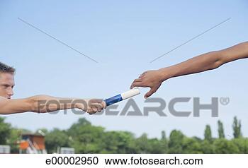 Stock Photography - runners passing 
baton in relay. 
fotosearch - search 
stock photos, 
pictures, images, 
and photo clipart