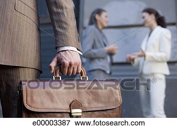 Picture - businessman's 
hand holding briefcase. 
fotosearch - search 
stock photos, 
pictures, images, 
and photo clipart