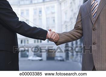 Stock Image - businessmen shaking 
hands. fotosearch 
- search stock 
photos, pictures, 
images, and photo 
clipart
