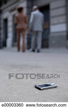 Stock Photography - pda left on ground. 
fotosearch - search 
stock photos, 
pictures, images, 
and photo clipart