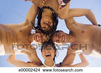 Stock Photo - couples in huddle. 
fotosearch - search 
stock photos, 
pictures, images, 
and photo clipart