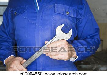 Stock Photography - hands of man with 
wrench. fotosearch 
- search stock 
photos, pictures, 
images, and photo 
clipart