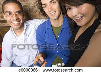 Stock Photography - friends with cell 
phone. fotosearch 
- search stock 
photos, pictures, 
images, and photo 
clipart