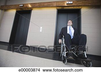 Stock Photo - businessman in 
wheelchair by 
elevators. fotosearch 
- search stock 
photos, pictures, 
images, and photo 
clipart