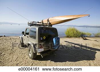 Stock Photography - kayak on vehicle 
at a beach. fotosearch 
- search stock 
photos, pictures, 
images, and photo 
clipart