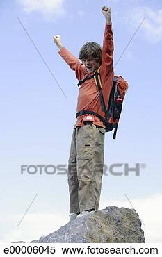 Stock Image - boy with arms 
raised. fotosearch 
- search stock 
photos, pictures, 
images, and photo 
clipart
