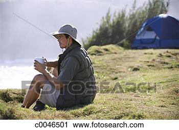 Stock Photography - man camping. fotosearch 
- search stock 
photos, pictures, 
images, and photo 
clipart