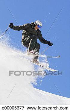 Picture - downhill skier 
making a jump. 
fotosearch - search 
stock photos, 
pictures, images, 
and photo clipart