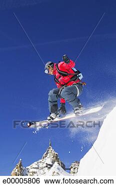 Stock Photo - snowboarder jumping 
off in mid-air. 
fotosearch - search 
stock photos, 
pictures, images, 
and photo clipart