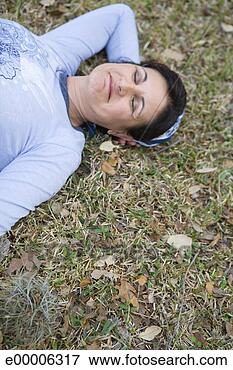 Picture - sleeping woman 
in grass. fotosearch 
- search stock 
photos, pictures, 
images, and photo 
clipart
