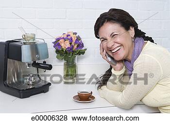 Stock Photo - smiling woman 
by espresso machine. 
fotosearch - search 
stock photos, 
pictures, images, 
and photo clipart