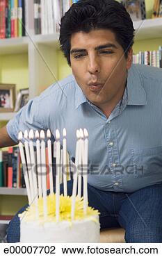 Stock Photo - man blowing birthday 
candles. fotosearch 
- search stock 
photos, pictures, 
images, and photo 
clipart