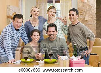 Stock Photo - smiling friends 
at party. fotosearch 
- search stock 
photos, pictures, 
images, and photo 
clipart