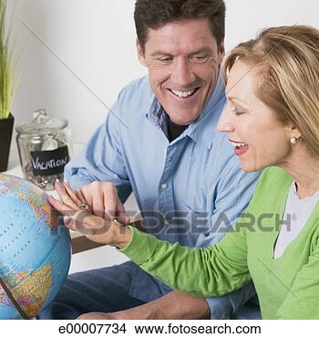 Stock Photo - couple choosing 
a vacation destination. 
fotosearch - search 
stock photos, 
pictures, images, 
and photo clipart