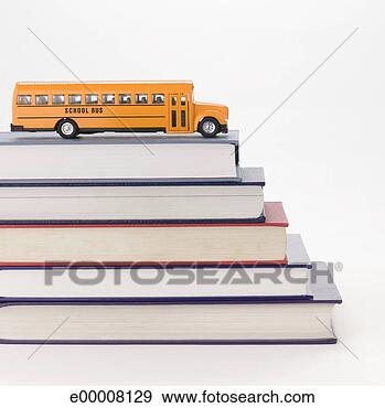 Stock Photograph - toy bus and stack 
of books. fotosearch 
- search stock 
photos, pictures, 
images, and photo 
clipart