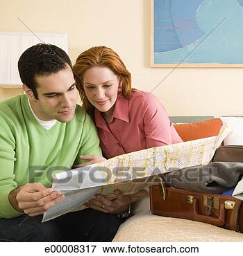 Picture - couple on vacation 
looking at map. 
fotosearch - search 
stock photos, 
pictures, images, 
and photo clipart
