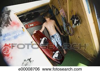 Stock Photo - man holding wakeboard. 
fotosearch - search 
stock photos, 
pictures, images, 
and photo clipart