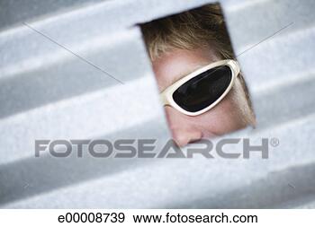 Stock Photograph - man looking through 
small window. 
fotosearch - search 
stock photos, 
pictures, images, 
and photo clipart