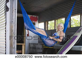 Stock Photography - woman wearing 
bikini in hammock. 
fotosearch - search 
stock photos, 
pictures, images, 
and photo clipart