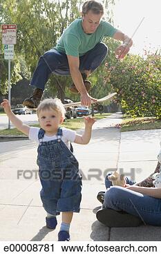 Stock Photography - man jumping on 
skateboard with 
toddler. fotosearch 
- search stock 
photos, pictures, 
images, and photo 
clipart