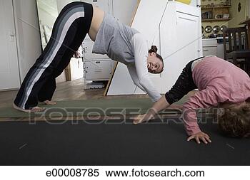 Stock Image - mother and toddler 
doing yoga. fotosearch 
- search stock 
photos, pictures, 
images, and photo 
clipart