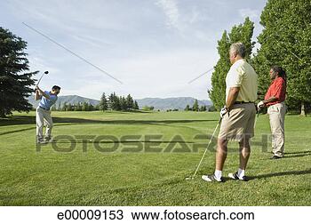 Stock Photo - friends playing 
golf on golf course. 
fotosearch - search 
stock photos, 
pictures, images, 
and photo clipart