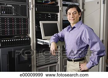 Stock Photograph - computer technician 
in server room. 
fotosearch - search 
stock photos, 
pictures, images, 
and photo clipart