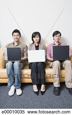 Stock Image - three people using 
laptop computers. 
fotosearch - search 
stock photos, 
pictures, images, 
and photo clipart