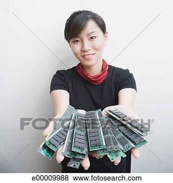 Stock Photo - woman holding 
memory chips. 
fotosearch - search 
stock photos, 
pictures, images, 
and photo clipart